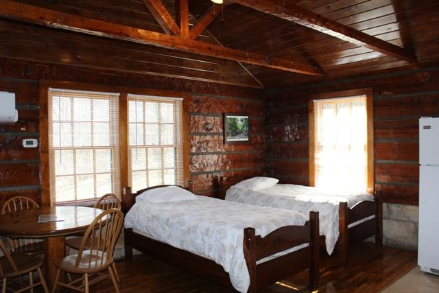 Rustic Cabin Living Area with Twin Beds