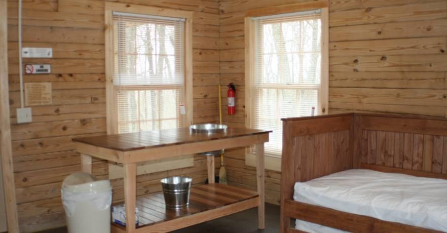 Camping Cabin Inside sink and trundle bed 