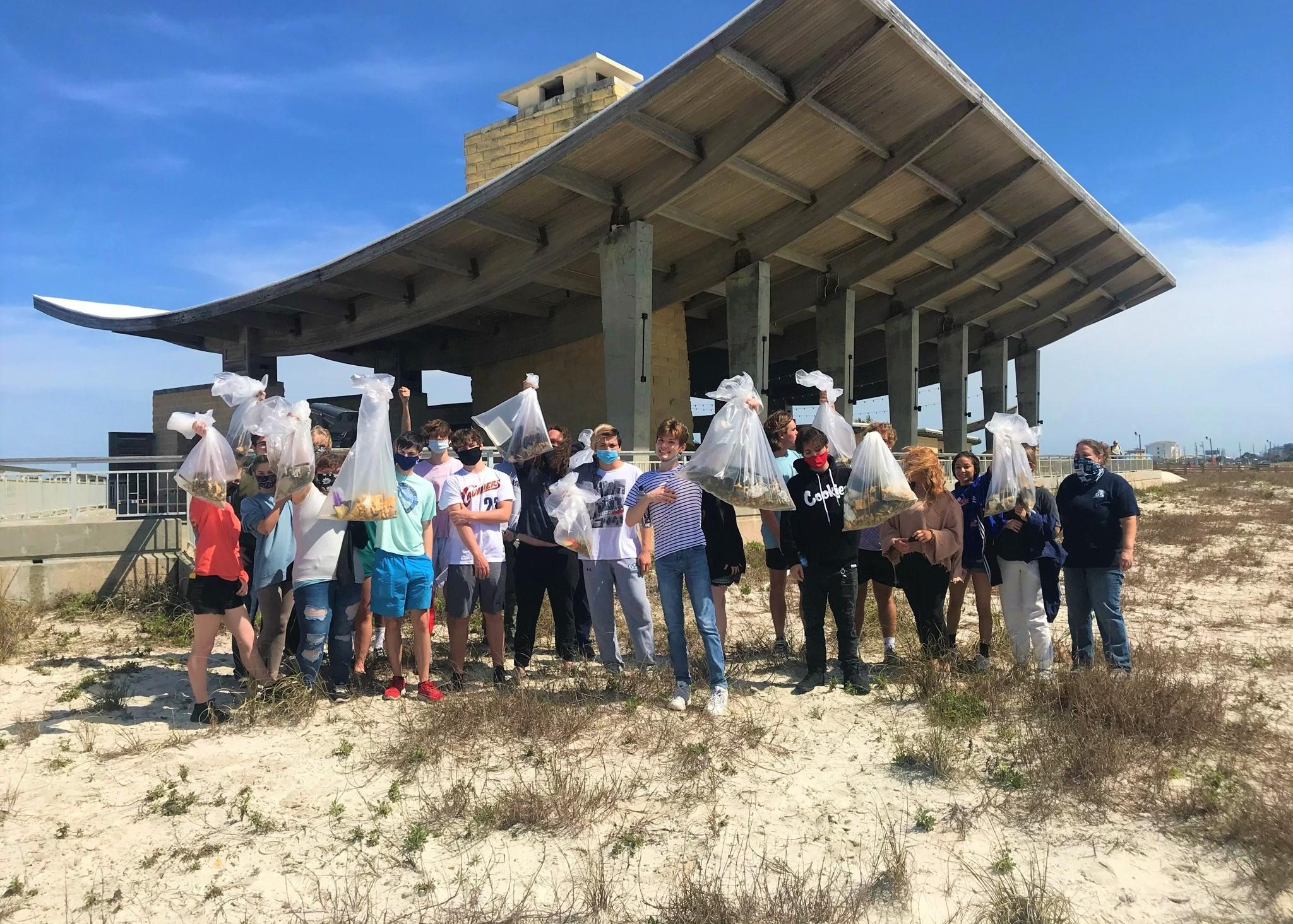 Gulf Shores High School Students Help to Pick up Debris in the Dunes
