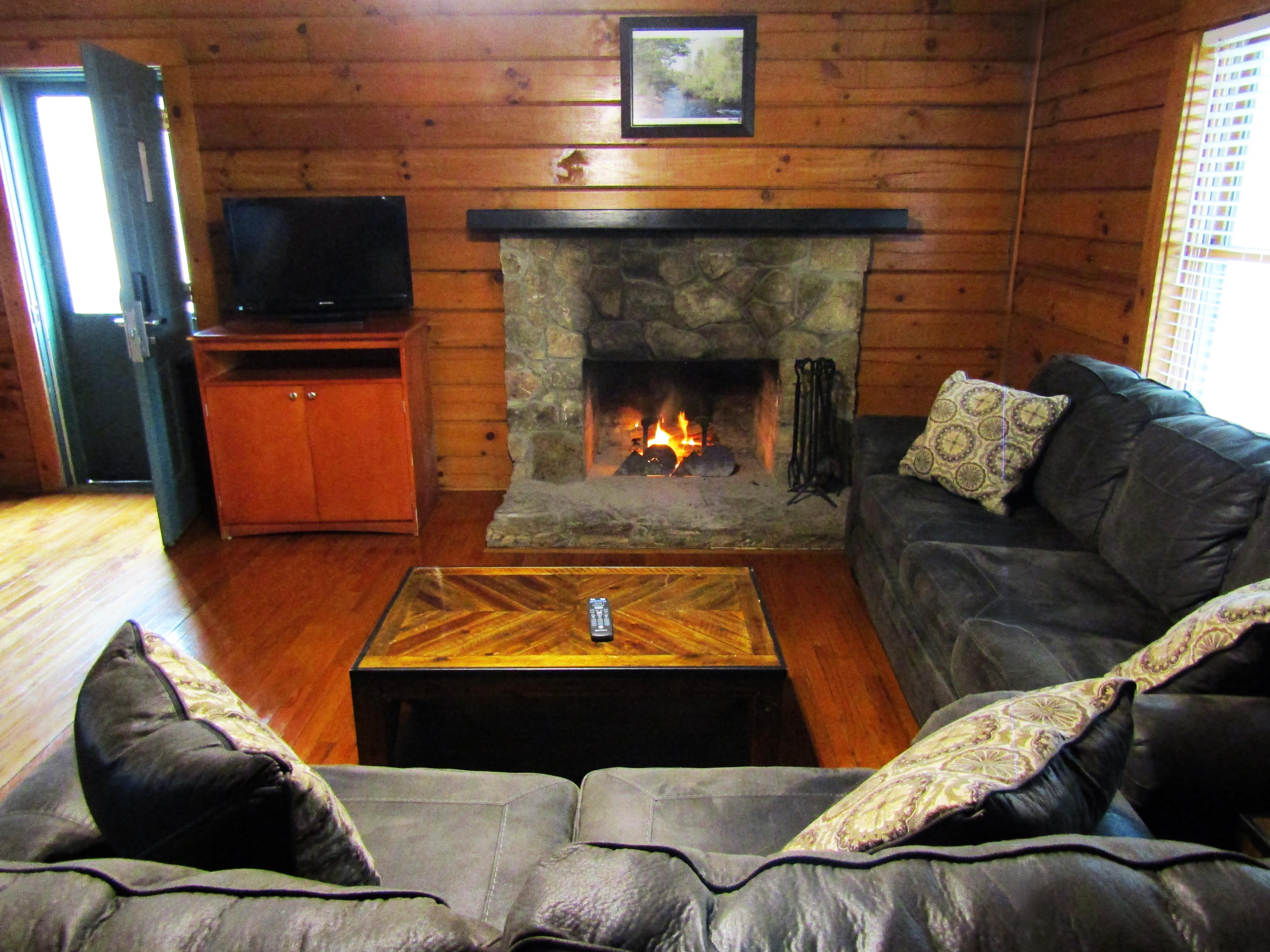 Living room with lit fireplace